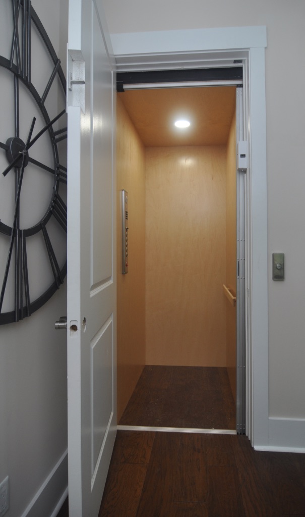 Private four-stop elevator connecting garage to rooftop